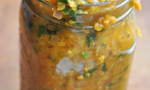 jar full of curried red lentil and spinach stew
