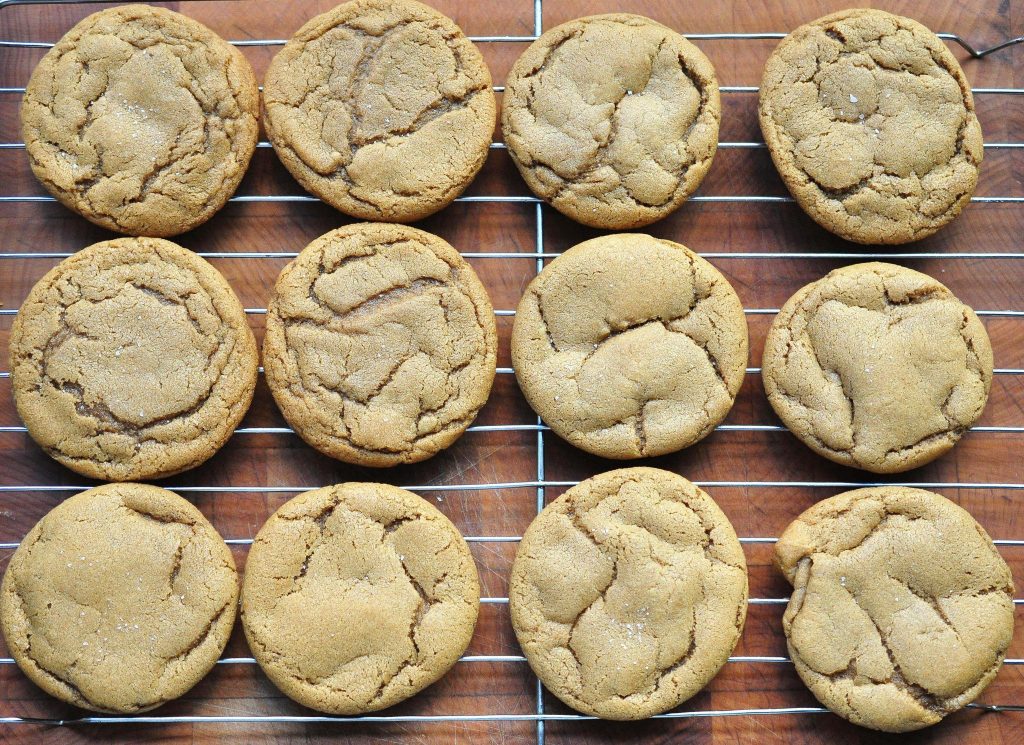dozen soft nutmeg cookies on a cooking rack