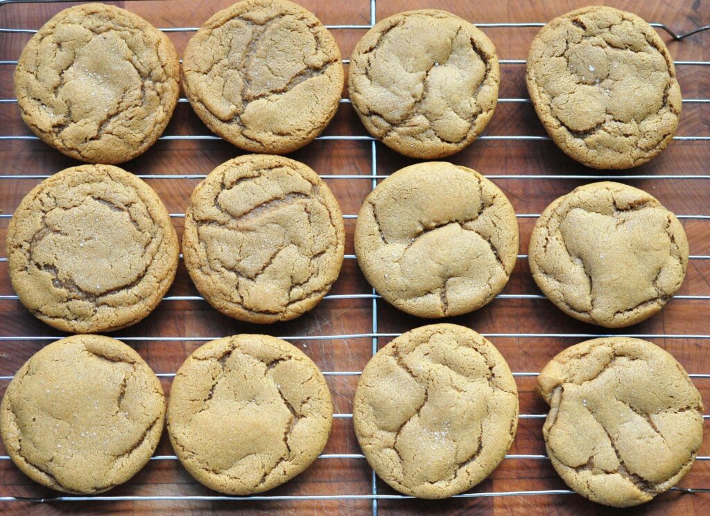 dozen soft nutmeg cookies on a cooking rack