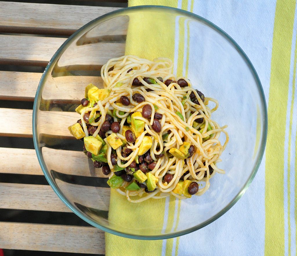 avocado and black beans tossed with noodles