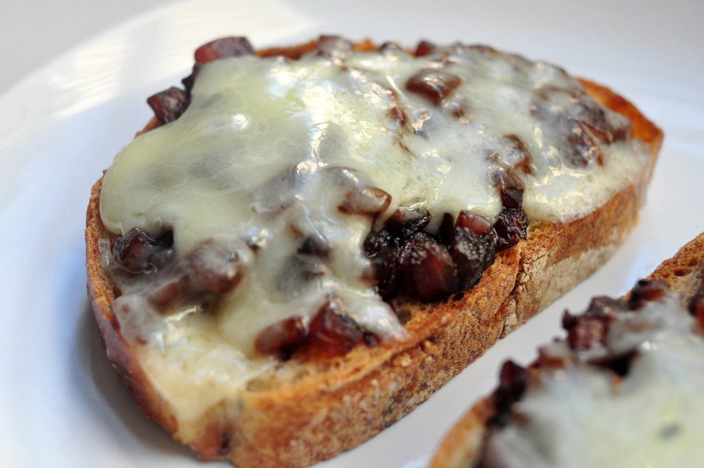 toast with caramelized onion and cheddar melted on top