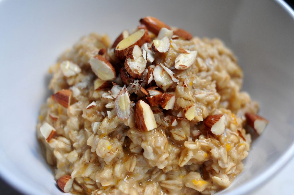 baklava oatmeal in a bowl, topped with chopped almonds